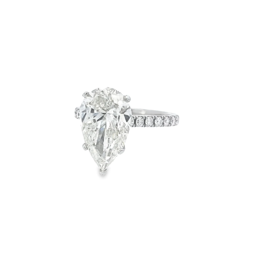 PEAR CUT DIAMOND SOLITAIRE SET IN PLATINUM WITH DIAMOND SHOULDERS