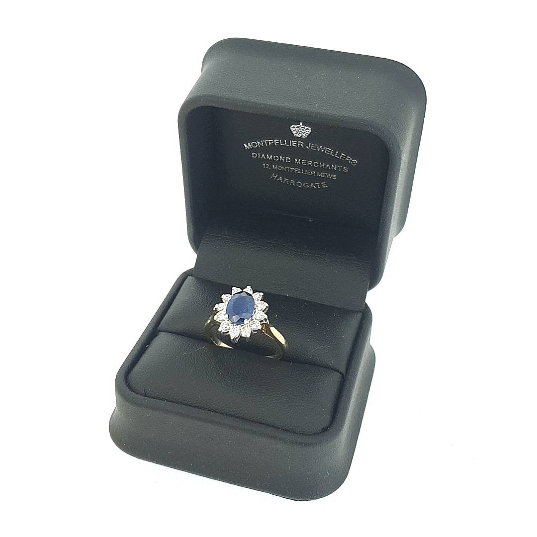 Oval Cut Sapphire & Diamond Cluster Ring Set in 18ct Gold