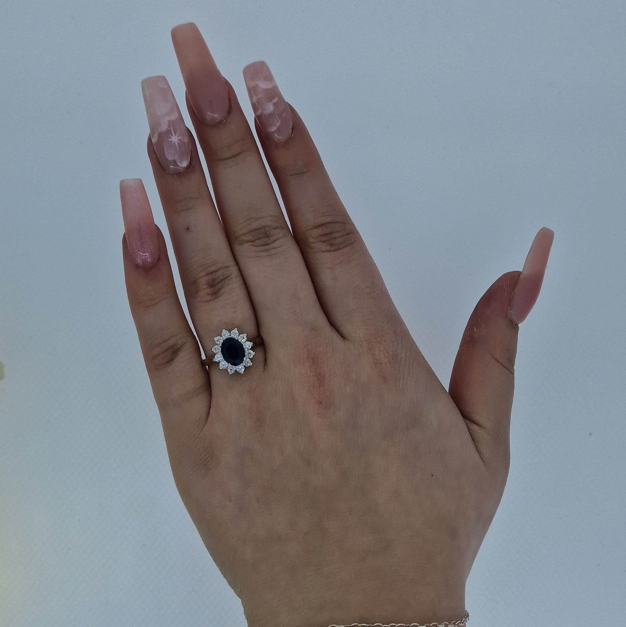 Oval Cut Sapphire & Diamond Cluster Ring Set in 18ct Gold