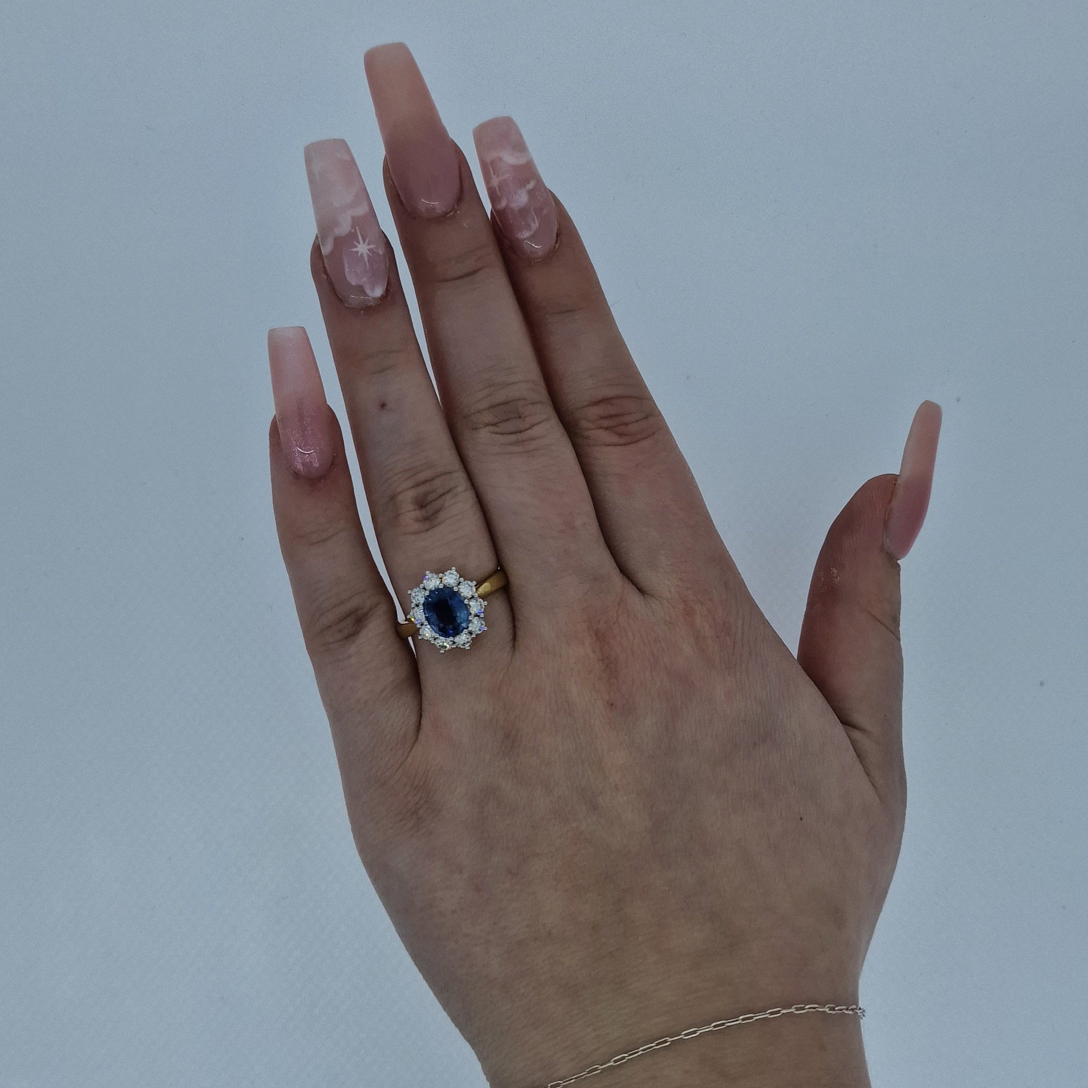 Oval Cut Sapphire & Diamond Cluster Ring Set in 18ct Gold