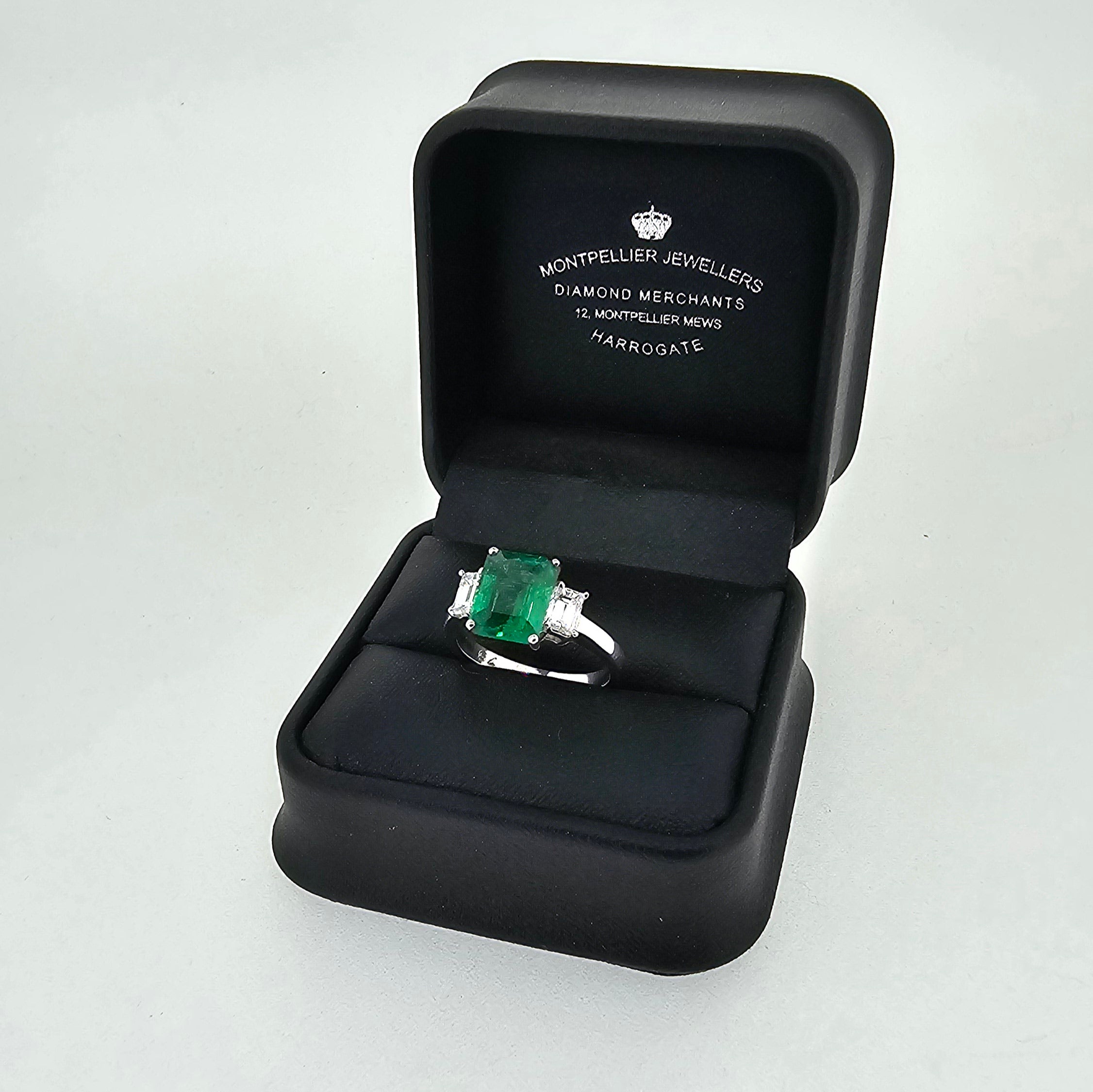 VIP Emerald Ring with Emerald Cut Diamond Side Stones Set in 18ct White Gold - Montpellier Jewellers