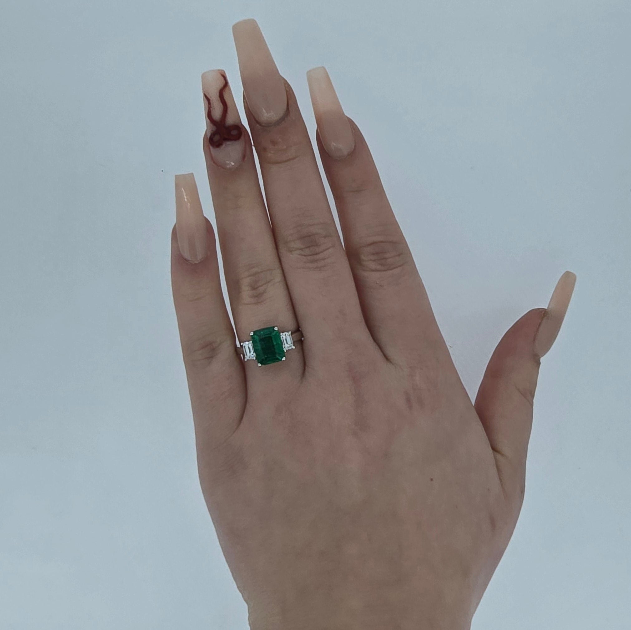 VIP Emerald Ring with Emerald Cut Diamond Side Stones Set in 18ct White Gold - Montpellier Jewellers
