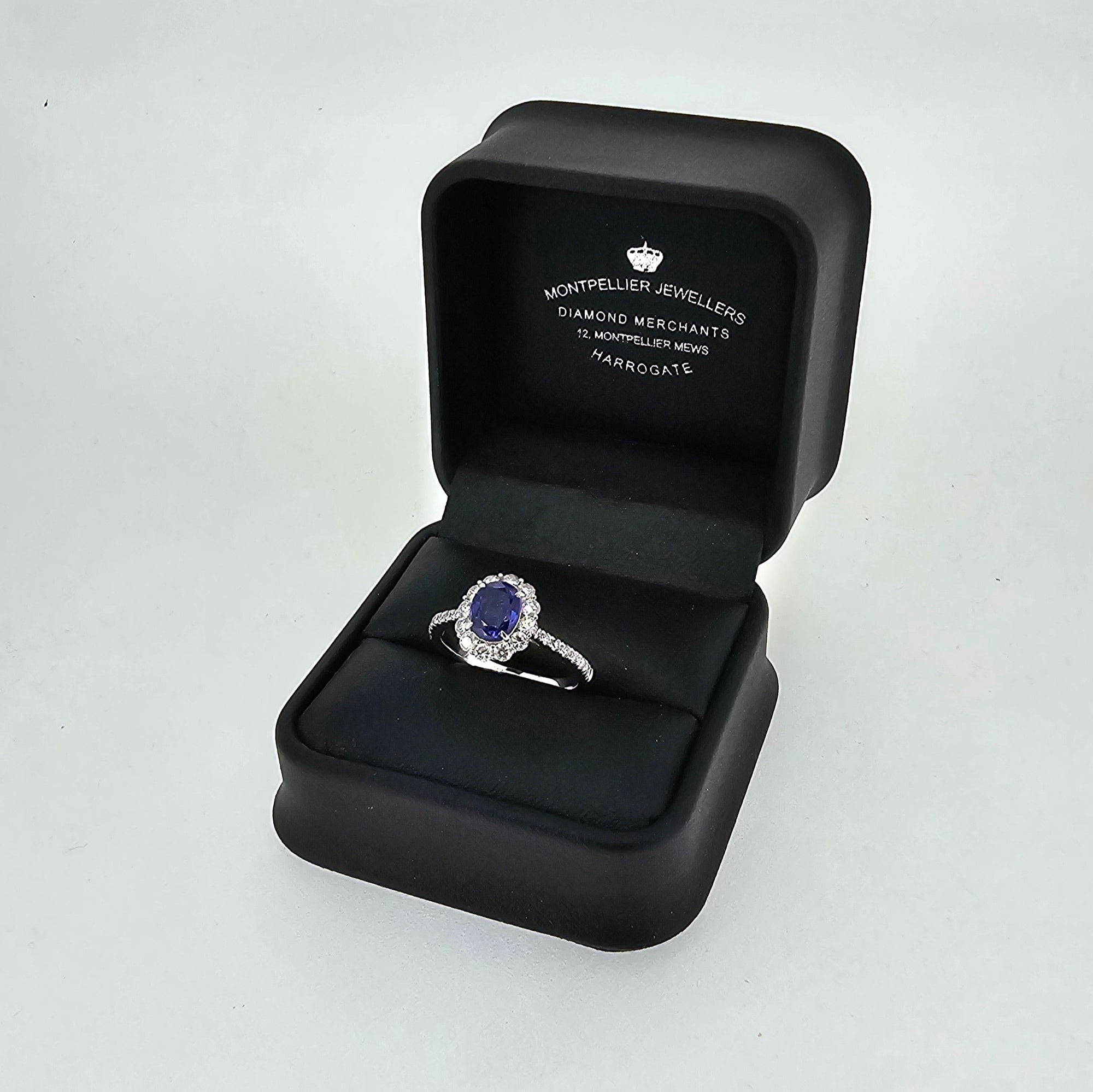 Oval Cut Sapphire & Diamond Cluster Ring with Diamond Shoulders Set in 18ct White Gold