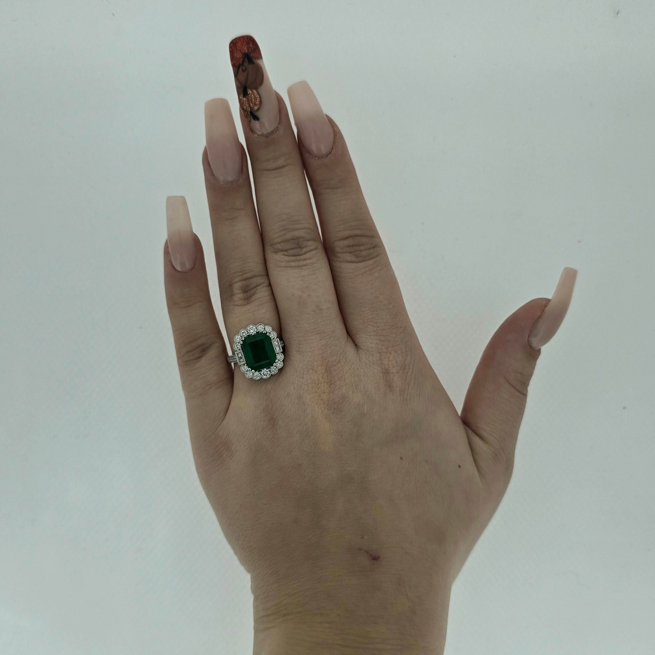 3.86ct Emerald and Diamond Cluster Ring with Diamond Shoulders Set in Platinum - Montpellier Jewellers