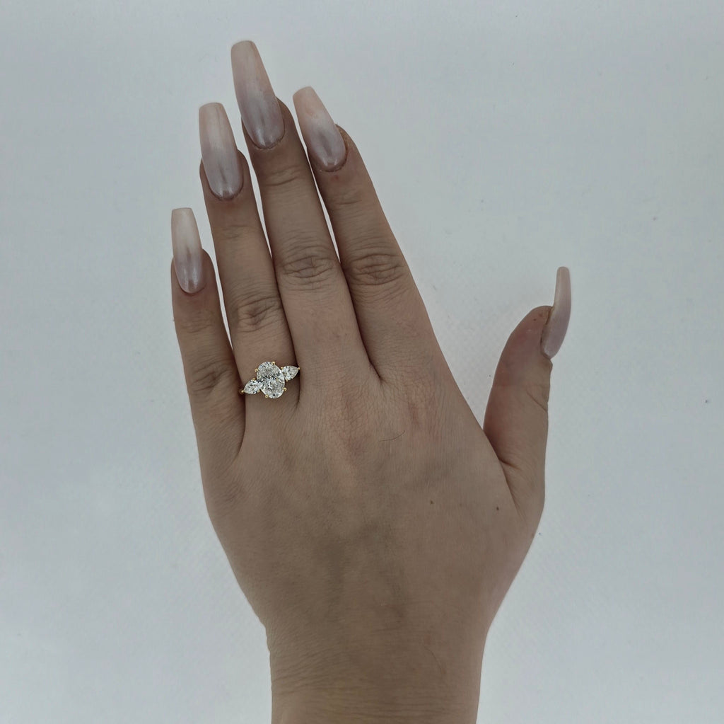 2.02ct D/VS2 Oval Cut LAB Diamond Ring with Pear Shape Side Stones Set in 18ct Yellow Gold