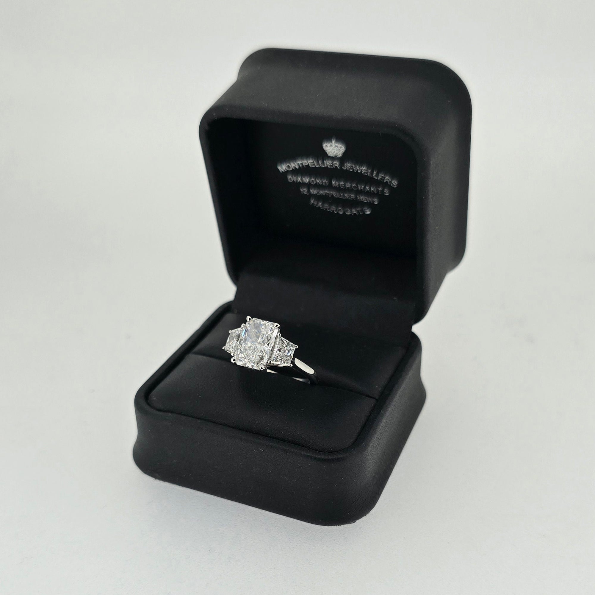 IGI 3.00ct D/VS2 Radiant Cut LAB Diamond Ring with Trapezoid Side Stones Set in Platinum - Montpellier Jewellers