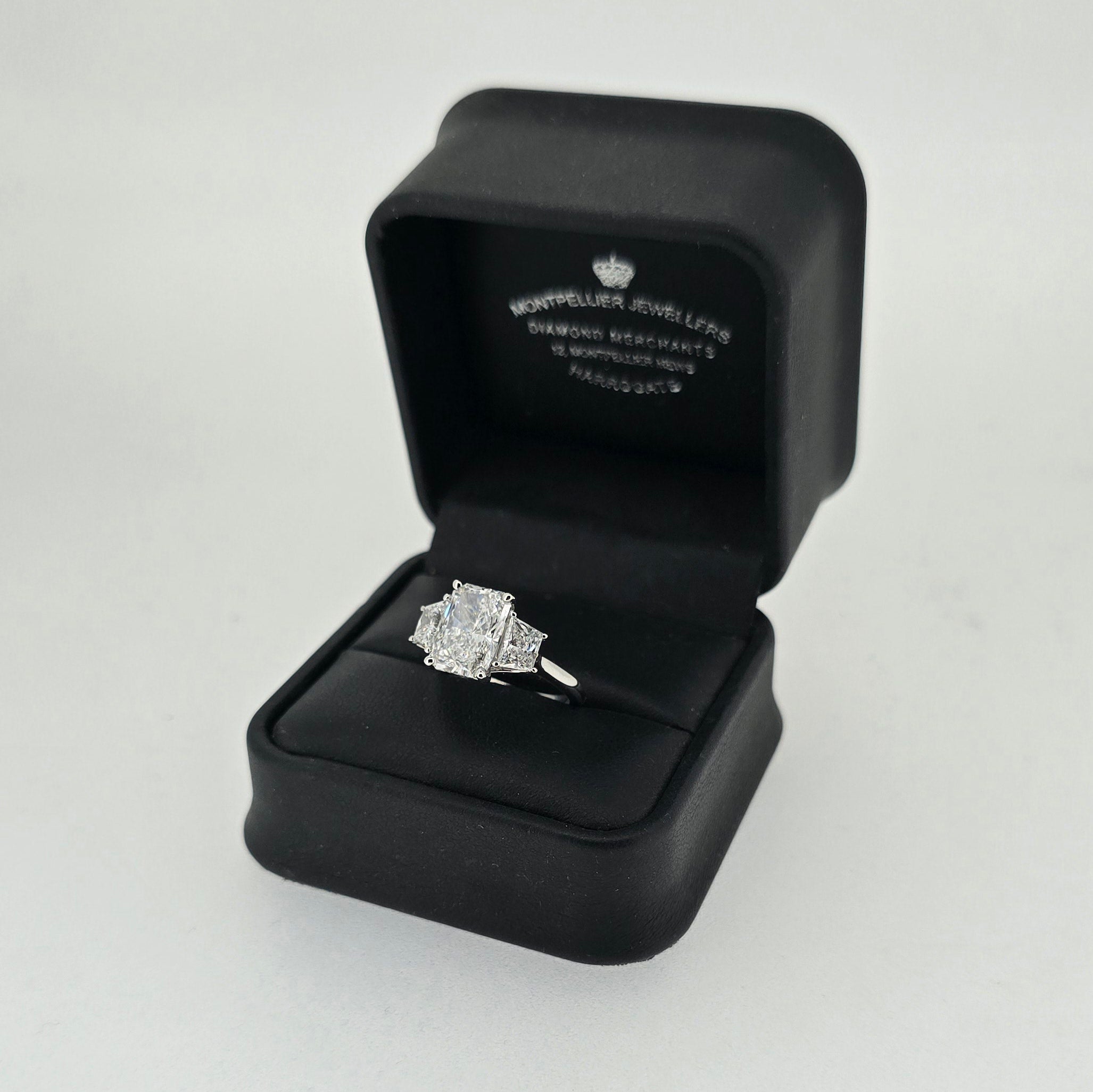 IGI 3.00ct D/VS2 Radiant Cut LAB Diamond Ring with Trapezoid Side Stones Set in Platinum - Montpellier Jewellers