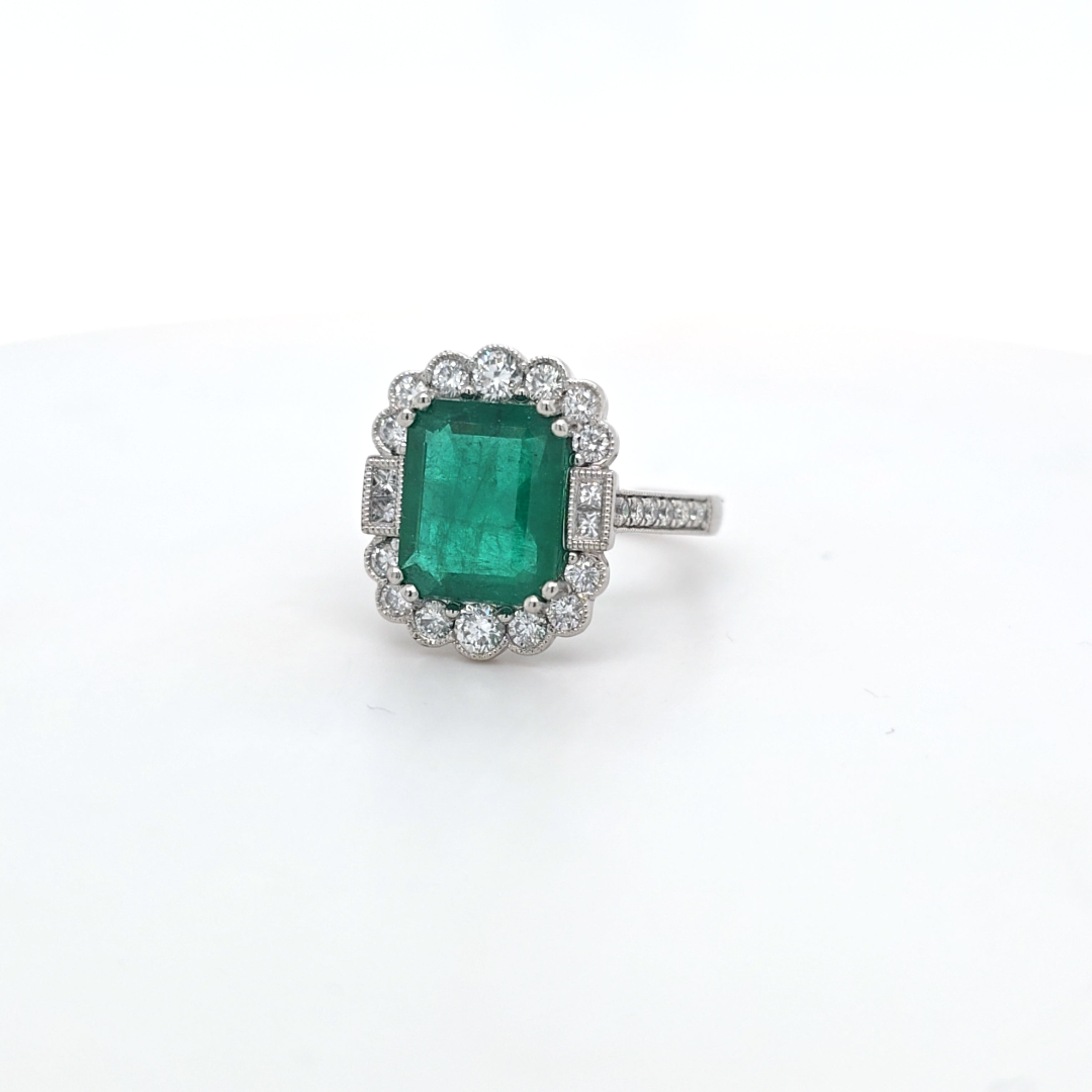 3.86ct Emerald and Diamond Cluster Ring with Diamond Shoulders Set in Platinum - Montpellier Jewellers