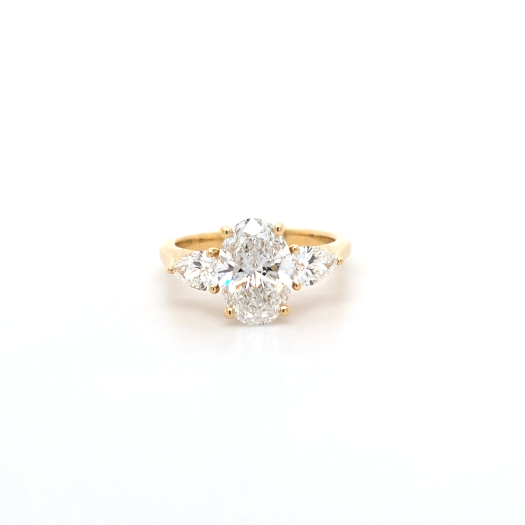 2.02ct D/VS2 Oval Cut LAB Diamond Ring with Pear Shape Side Stones Set in 18ct Yellow Gold