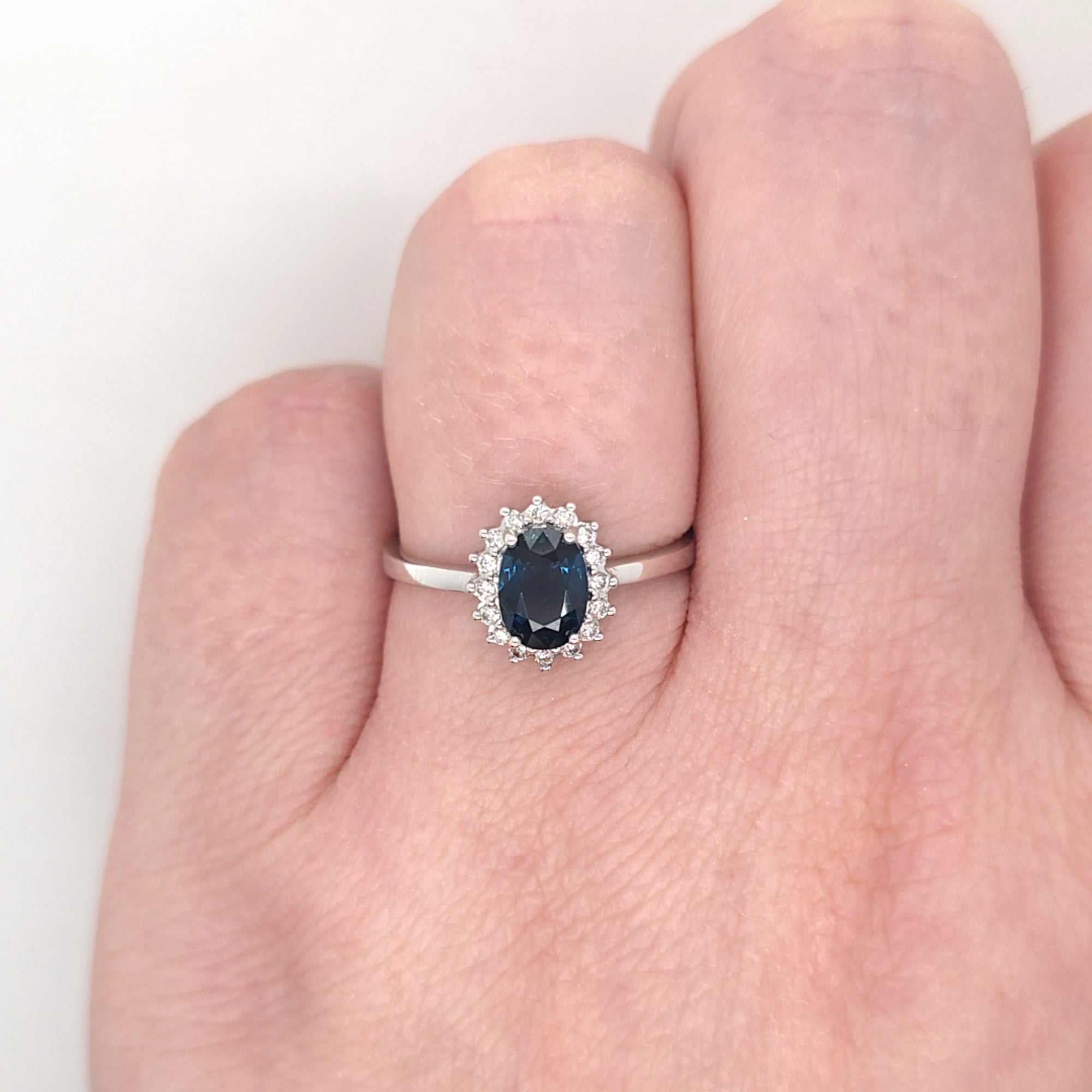 0.96ct Oval Cut Sapphire & Diamond Cluster Ring Set in White Gold - Montpellier Jewellers