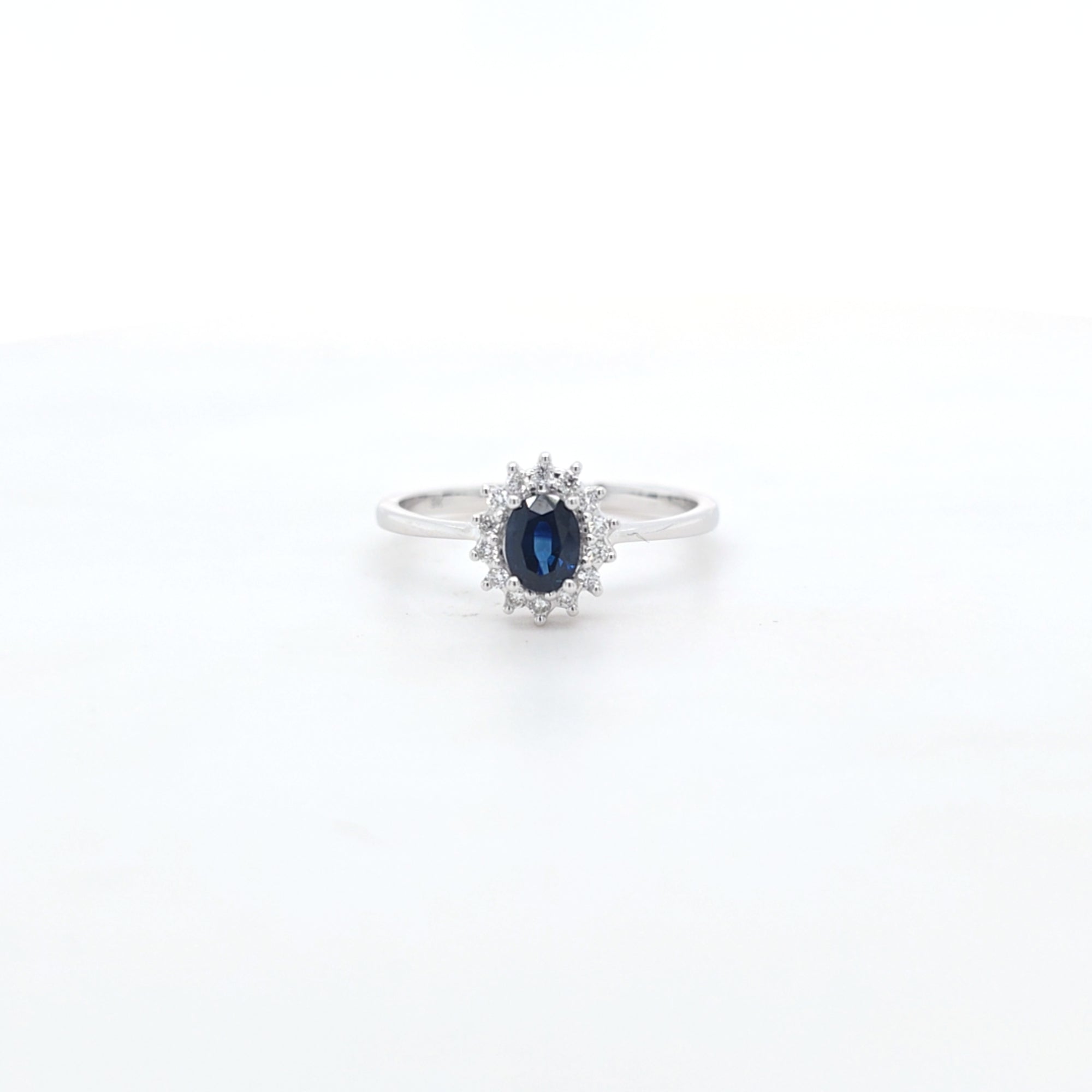 0.50ct Oval Cut Sapphire & Diamond Cluster Ring Set in White Gold - Montpellier Jewellers
