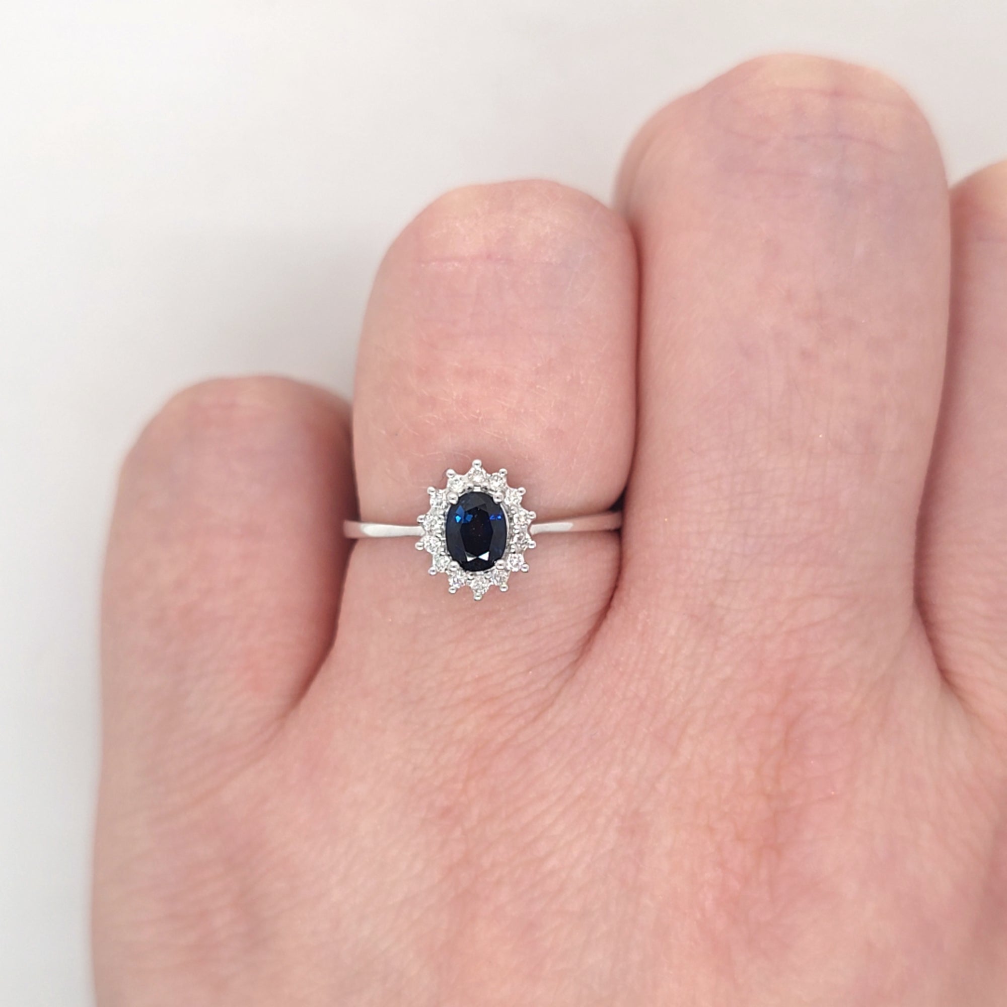 0.50ct Oval Cut Sapphire & Diamond Cluster Ring Set in White Gold - Montpellier Jewellers