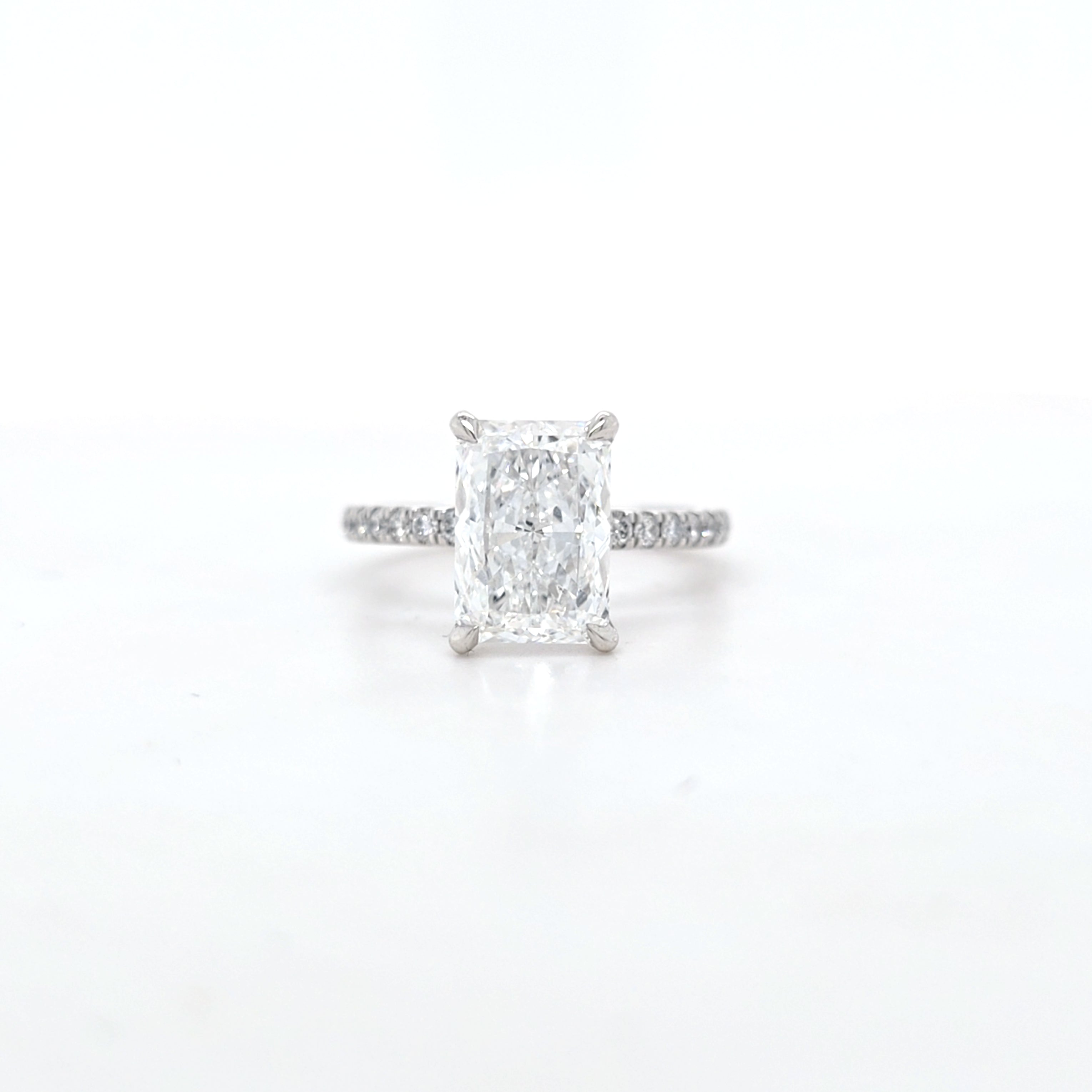 IGI 3.01ct D/VS2 Radiant Cut LAB Diamond Solitaire set in Platinum with Diamond Shoulders & Ruby Accent Stone - Montpellier Jewellers