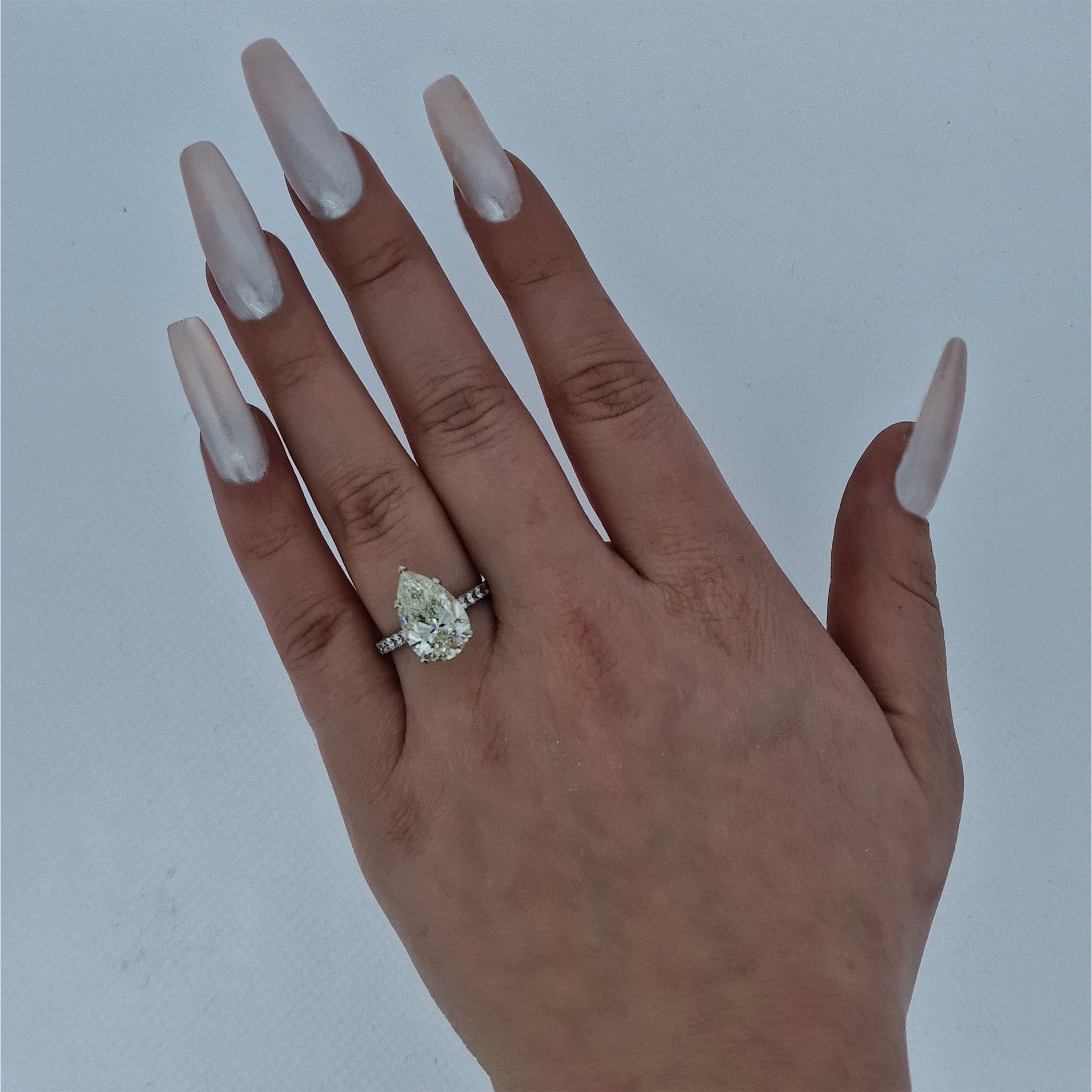 GIA 5.02ct L/SI1 Pear Cut Diamond Solitaire set in Platinum with Diamond Shoulders